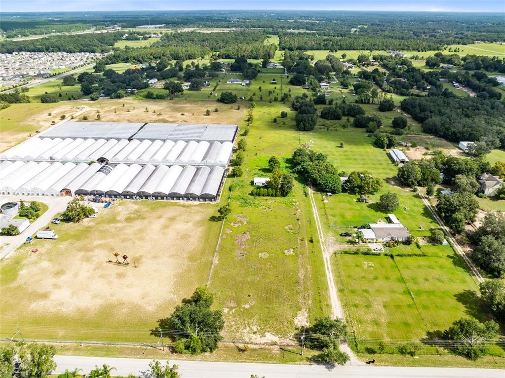 2719 West Kelly Park Road Apopka, FL 32712 - Photo 6 of 22 a view of a swimming pool with a yard