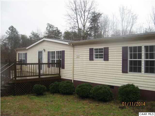 7389 Porters Road Esmont, VA 22937 - Photo 1 of 4 a front view of a house with a garden
