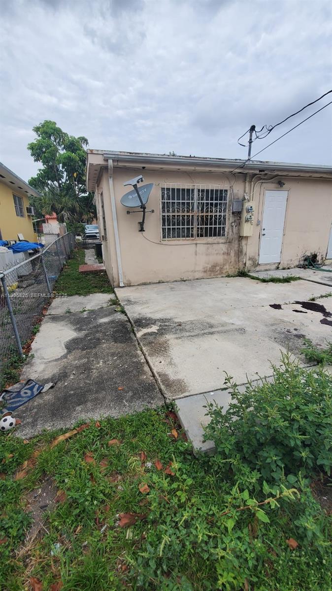 2980 Northwest 91st Street, Unit 1 Miami, FL 33147 - Photo 3 of 9 front view of a house with a yard