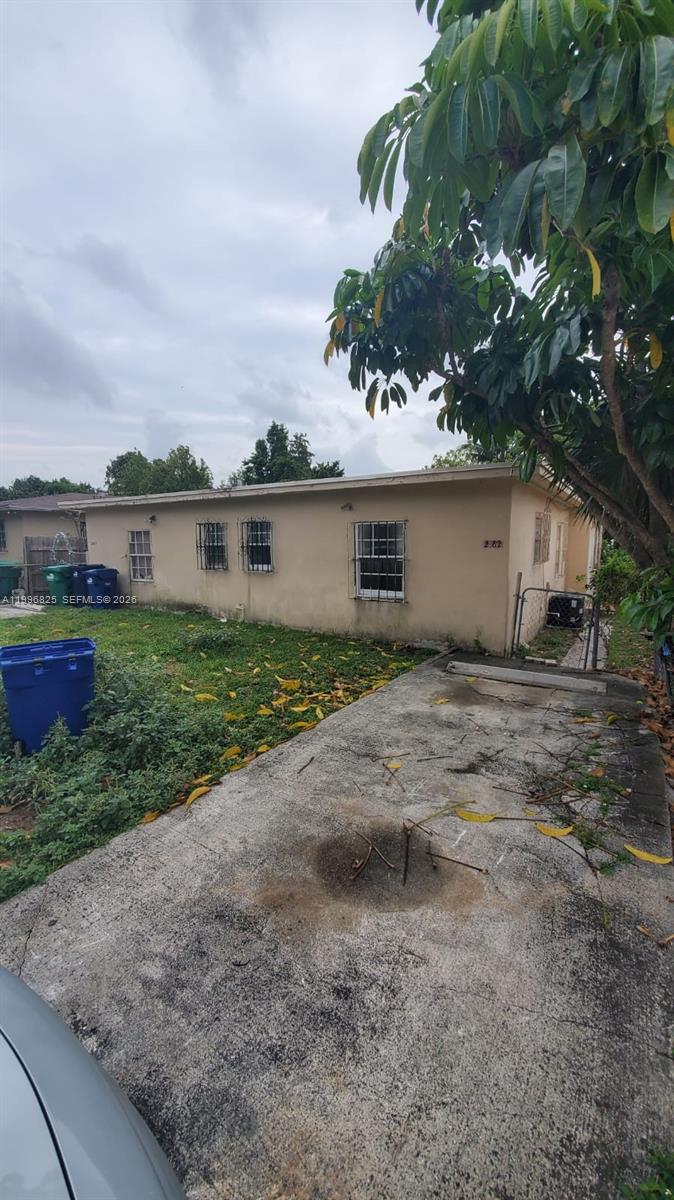 2980 Northwest 91st Street, Unit 1 Miami, FL 33147 - Photo 9 of 9 a view of a house with a yard