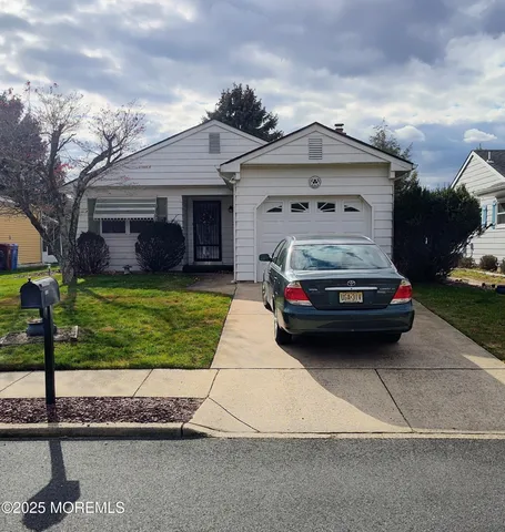 a car parked in front of a house