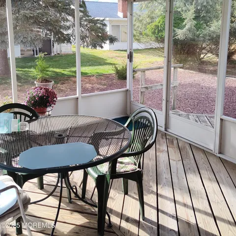 a view of a swimming pool with furniture