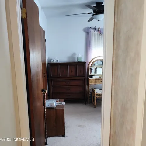 a bedroom with a bed and wall painting