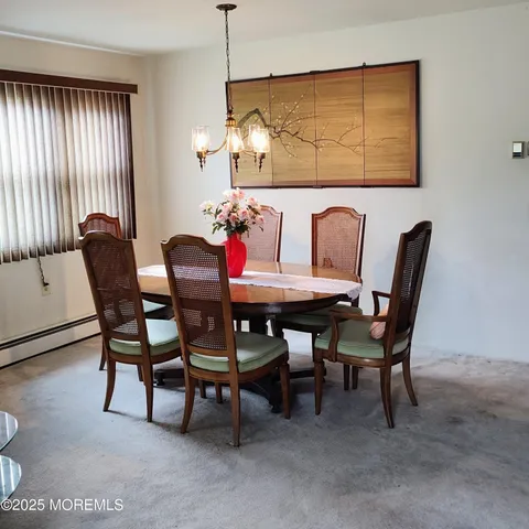 a view of a dining room with furniture
