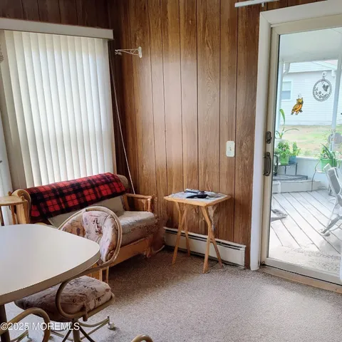 a view of a chair and tables in the patio