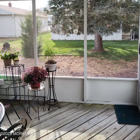 a view from deck with patio