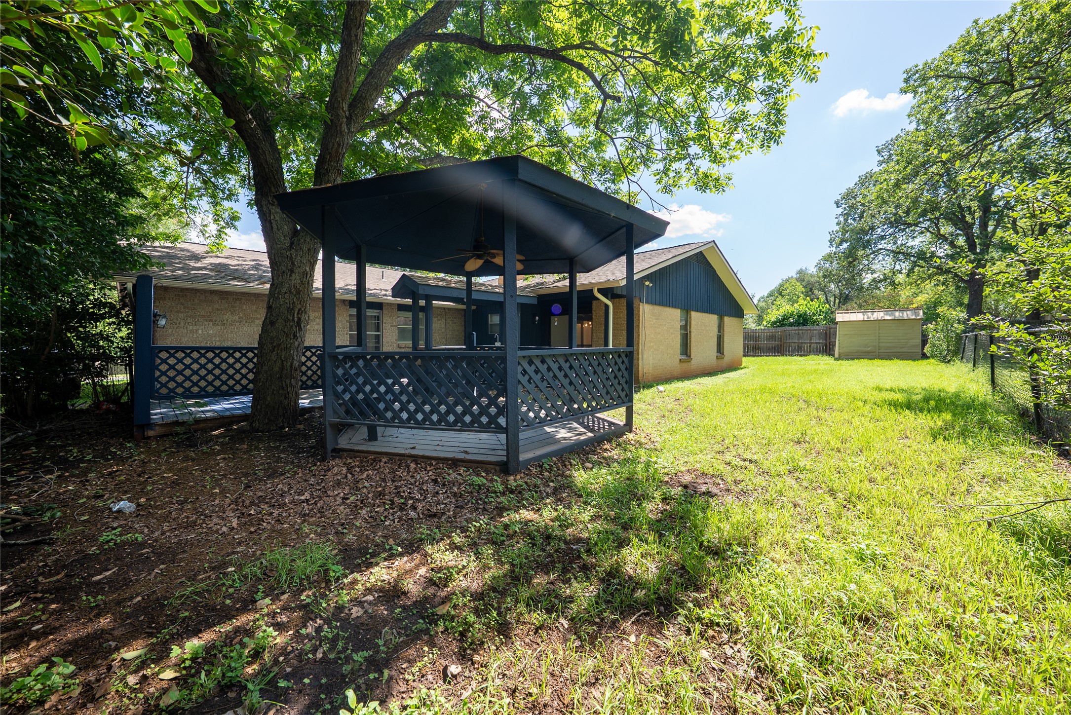 807 Country Club Road Georgetown, TX 78628 - Photo 28 of 28 a view of a house with backyard and sitting area