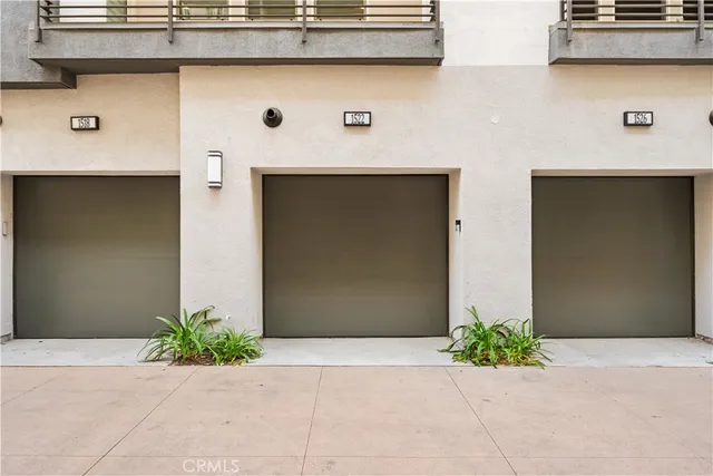 a front view of a house with garage