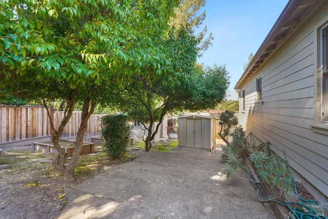 an aerial view of house with yard and swimming pool