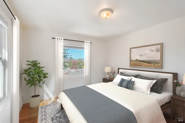 a bedroom with a bed and window