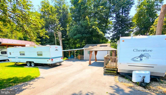 an outdoor space with seating area and barbeque oven