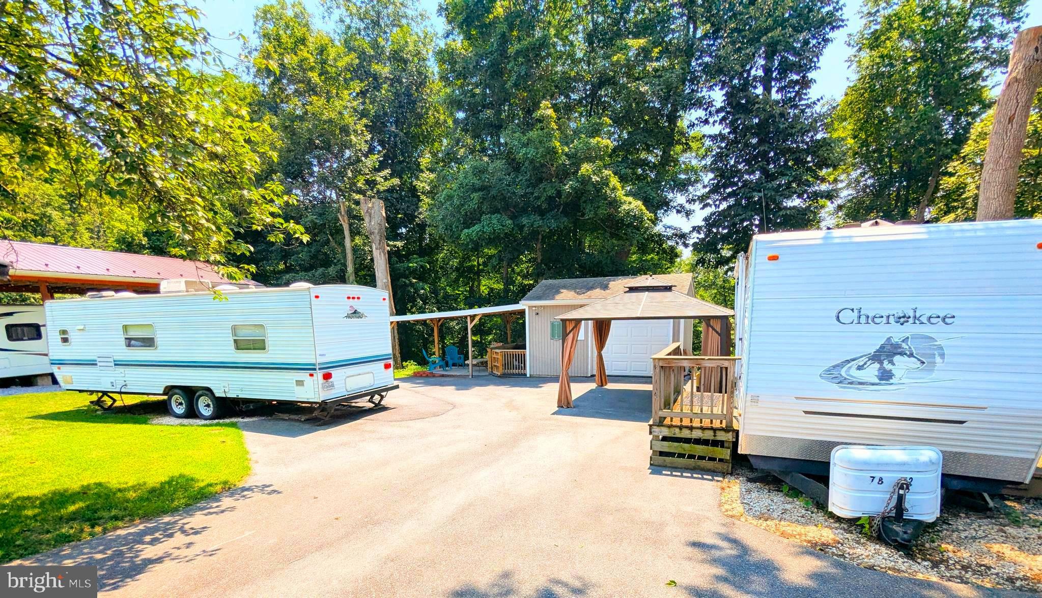 an outdoor space with seating area and barbeque oven