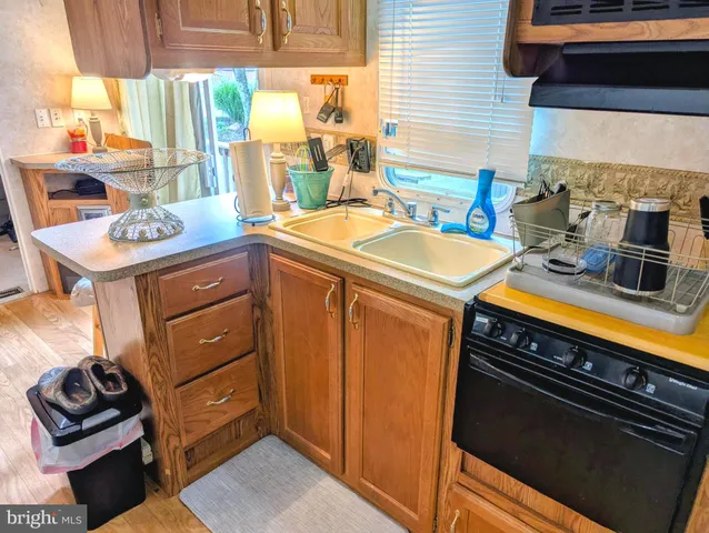 a kitchen with a stove and a sink