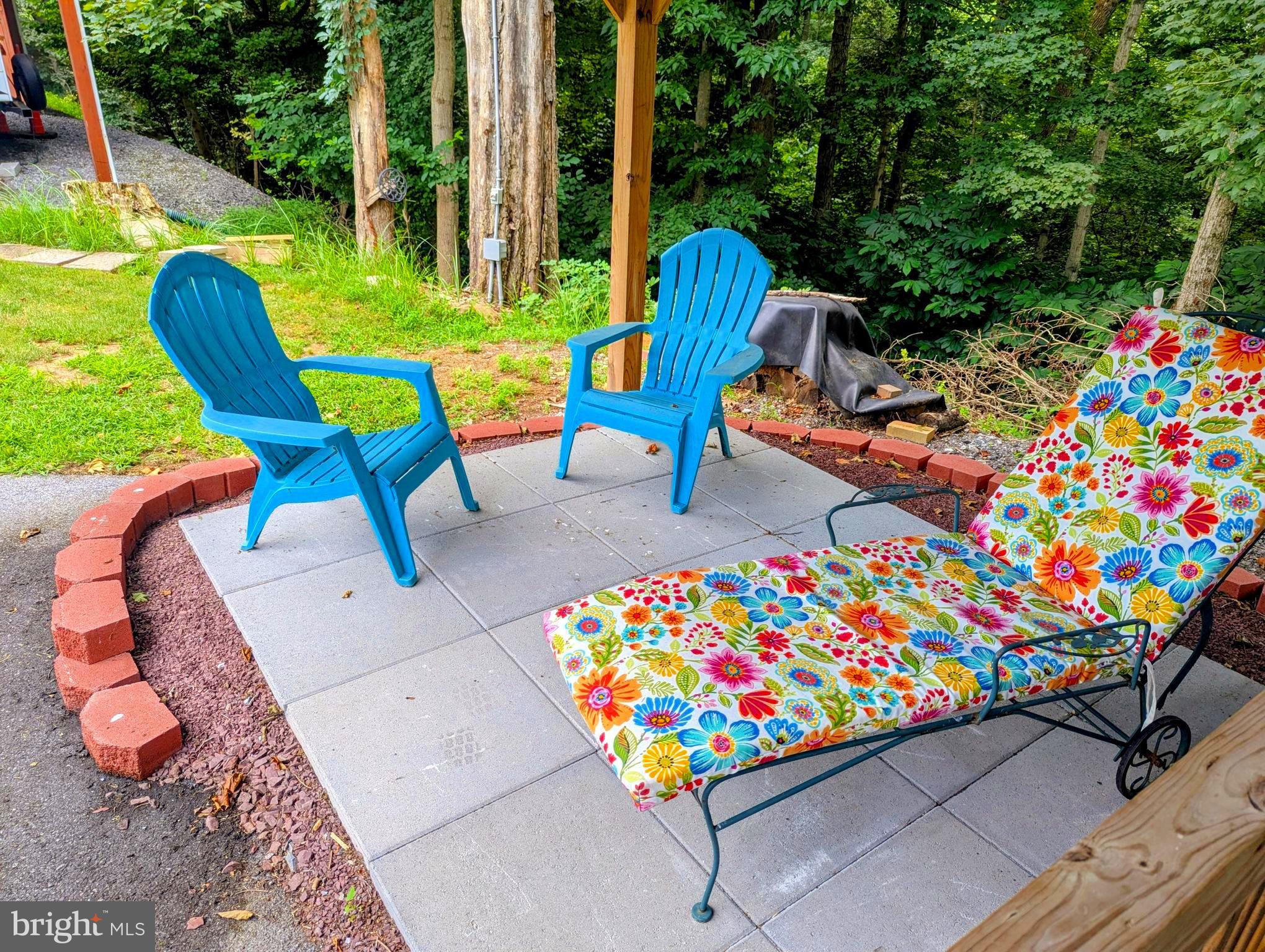 71 & 72 Boo Boo Boulevard Falling Waters, WV 25419 - Photo 6 of 13 a picture of table and chairs in patio