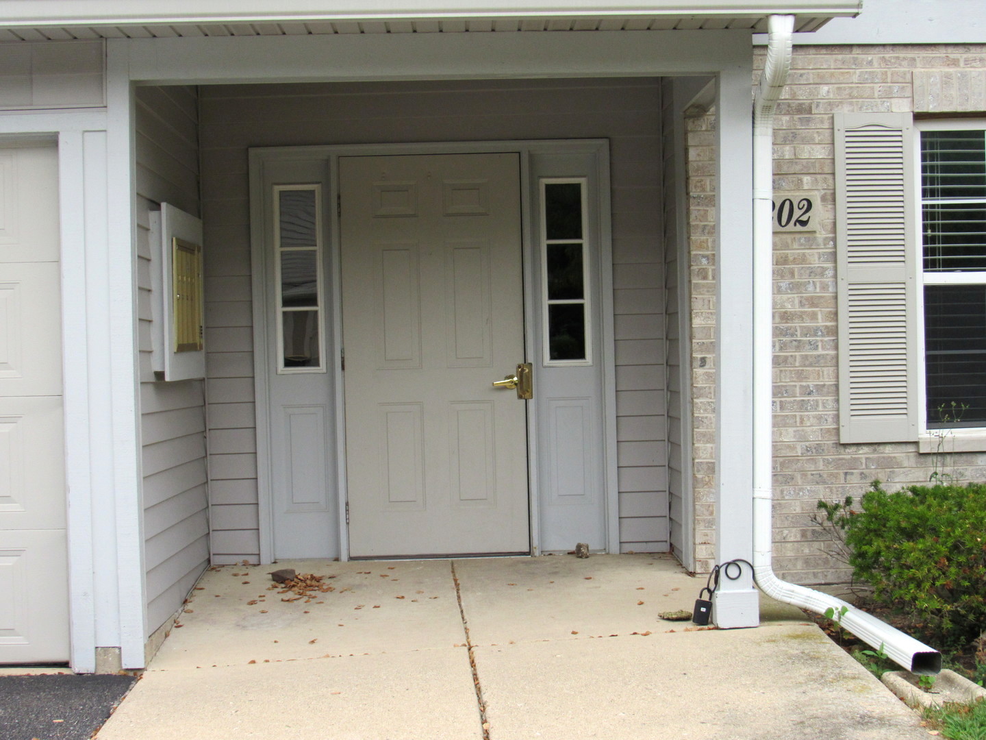 1202 North Red Oak Circle, Unit 2 Round Lake Beach, IL 60073 - Photo 1 of 18 front view of a house with a yard