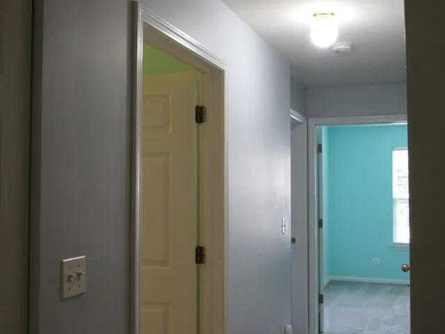 a bathroom with a toilet sink and shower