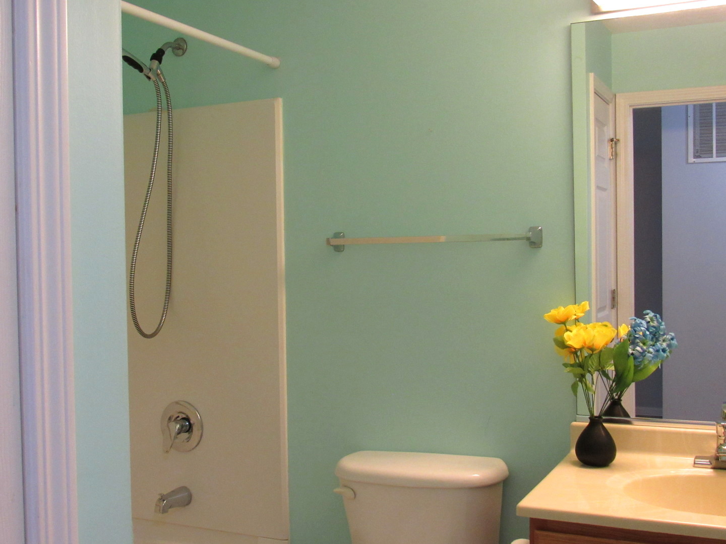 1202 North Red Oak Circle, Unit 2 Round Lake Beach, IL 60073 - Photo 9 of 18 a bathroom with a toilet sink and shower