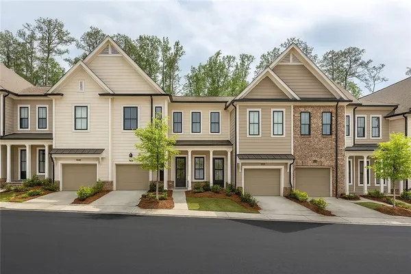 a kitchen with stainless steel appliances a sink a stove a microwave and cabinets