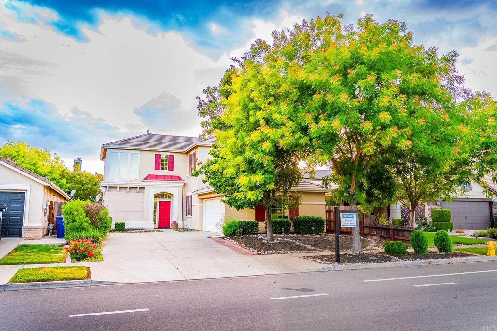 3005 Litt Road Modesto, CA 95355 - Photo 4 of 53 a front view of a house with a yard and garage