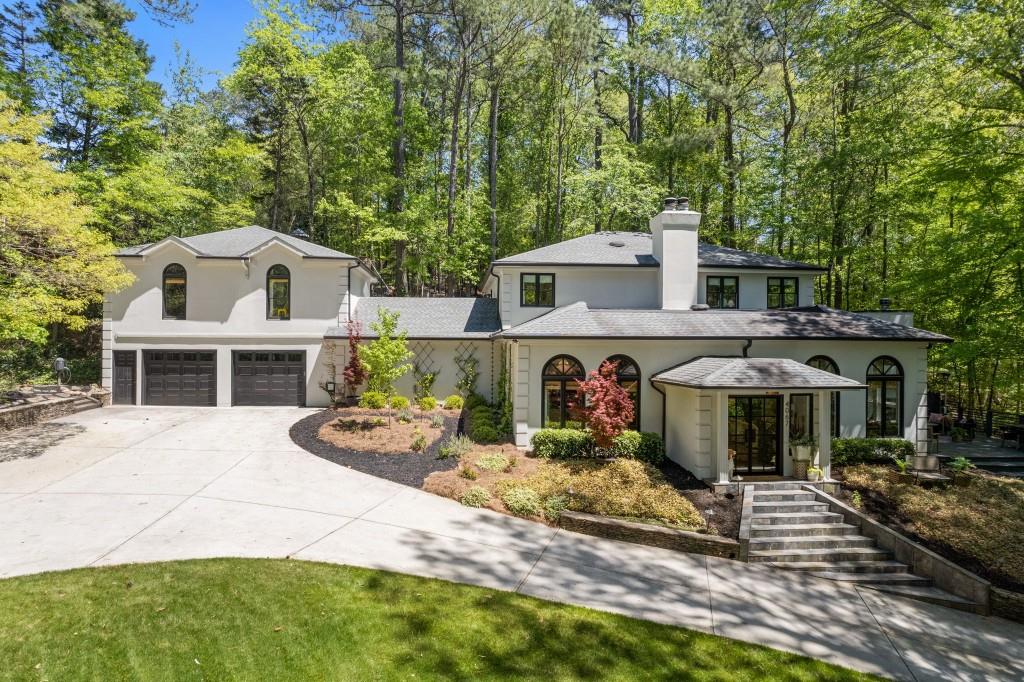 a front view of a house with garden