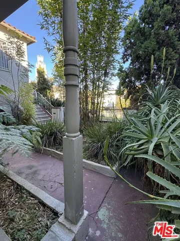 a sign board with yard in front of it