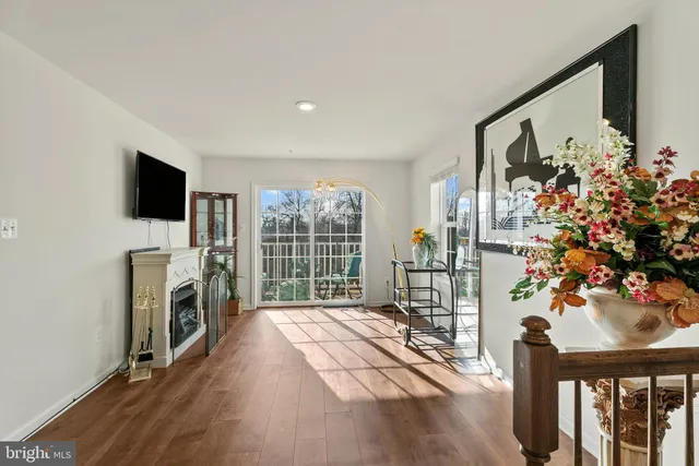 a living room with a fireplace furniture and a flat screen tv