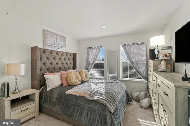 a bedroom with a bed and flat screen tv