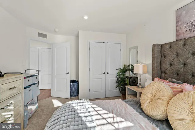 a bedroom with furniture and a bed