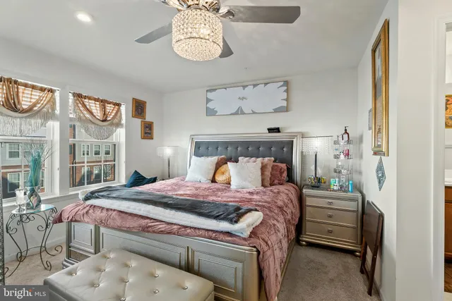 a bedroom with a bed and a table in it