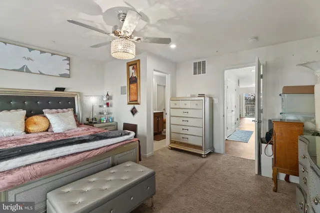 a bedroom with a bed and furniture