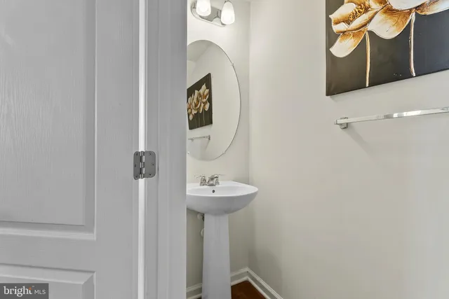 a bathroom with a sink and mirror