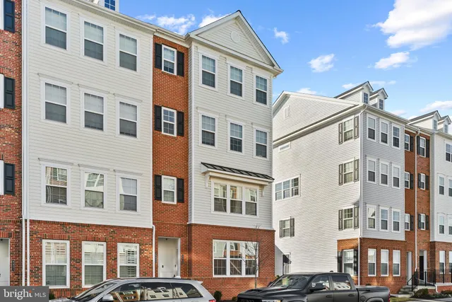 a front view of a building with large windows