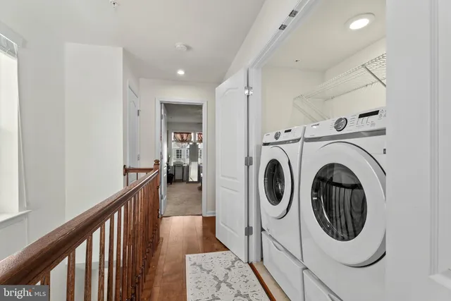 a view of a hallway with washer and dryer