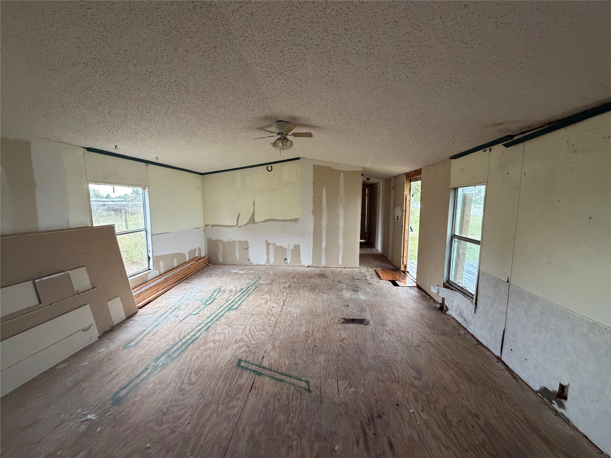 6430 Brockstein Road Sealy, TX 77474 - Photo 2 of 7 a spacious bedroom with a large bed and wooden floor