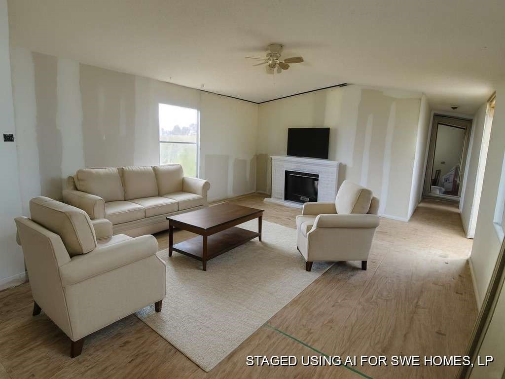 6430 Brockstein Road Sealy, TX 77474 - Photo 3 of 7 a living room with furniture and a flat screen tv