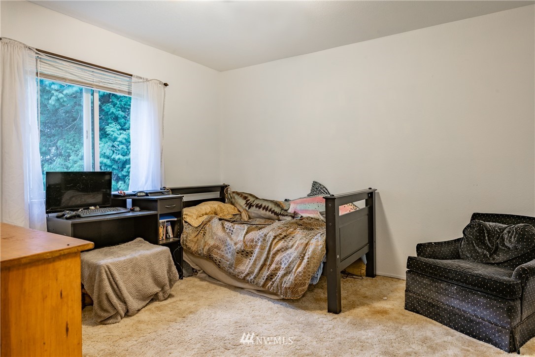 3017 Douglas Road Ferndale, WA 98248 - Photo 18 of 35 a bedroom with bed and a couch