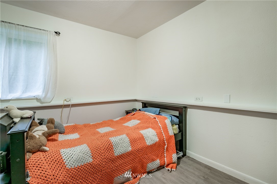 3017 Douglas Road Ferndale, WA 98248 - Photo 24 of 35 a bedroom with a bed and a window