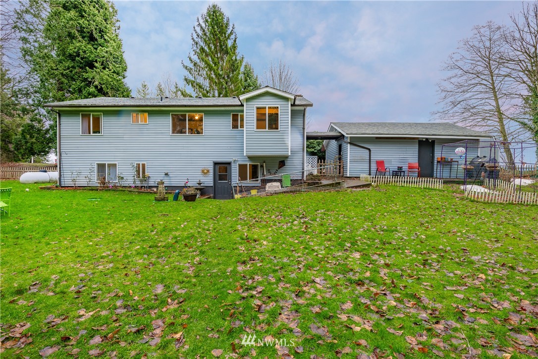 3017 Douglas Road Ferndale, WA 98248 - Photo 3 of 35 a view of a house with a big yard and large trees
