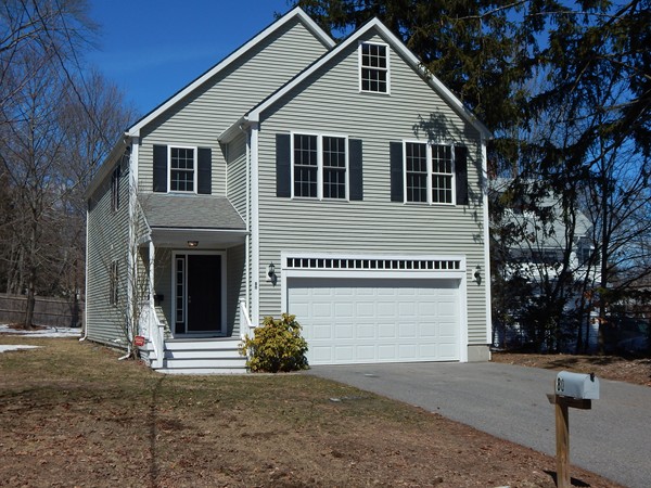 a view of a house with a yard and garage