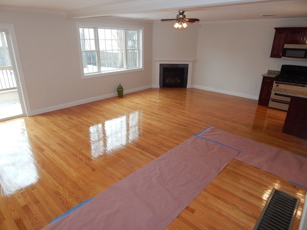 80 Locust Street Brockton, MA 02301 - Photo 5 of 20 a view of empty room with wooden floor and fan