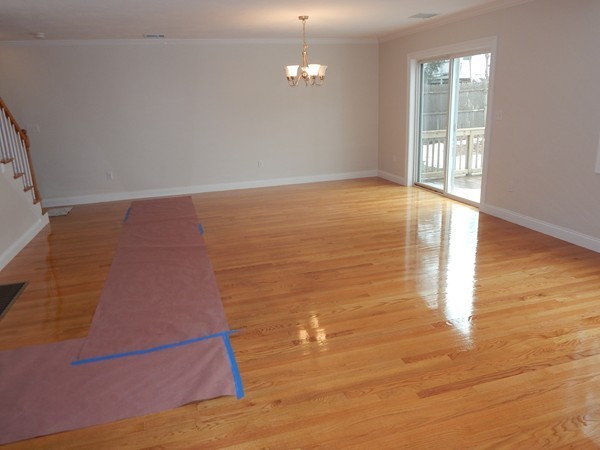 80 Locust Street Brockton, MA 02301 - Photo 6 of 20 en empty room with wooden floor and windows