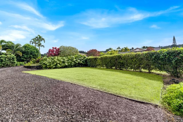 a view of a green field with clear sky