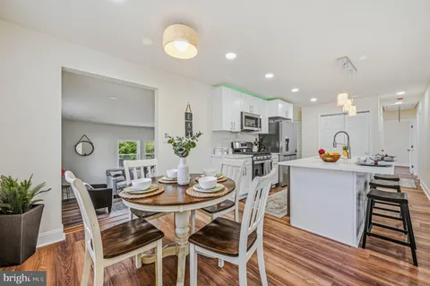 a kitchen with a table and chairs in it