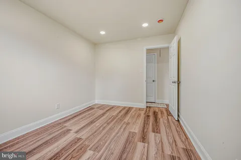 a view of room with wooden floor