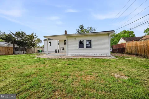 a front view of house with yard and seating area