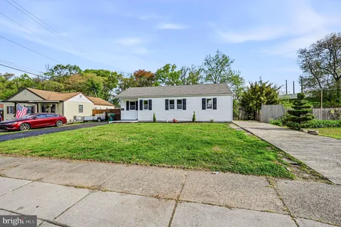 a view of house with yard and entertaining space