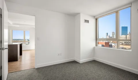 a view of a living room with a large window