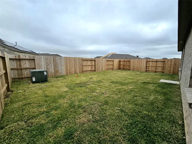 a view of a big room with a big yard and potted plants