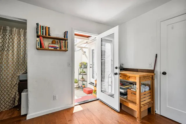 a room with lots of potted plants