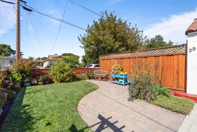 a view of a chair and tables in the patio